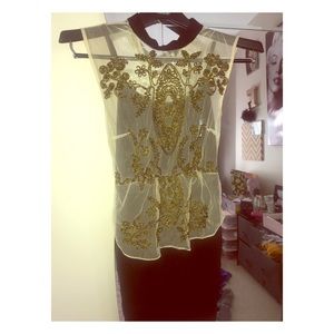 Beautiful gold embroidery on a little black dress